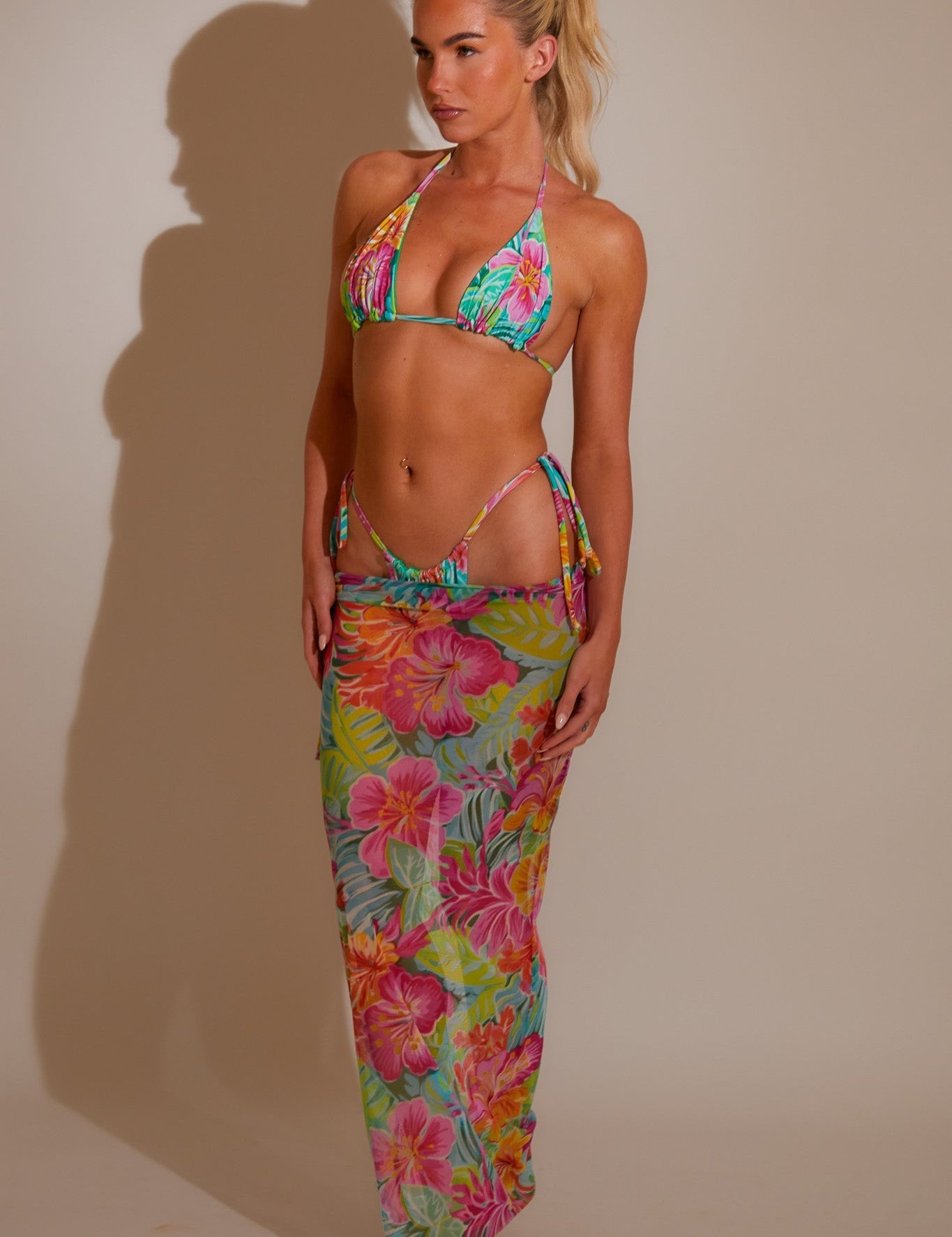 Styling a mesh swim skirt as a beach to bar cover-up