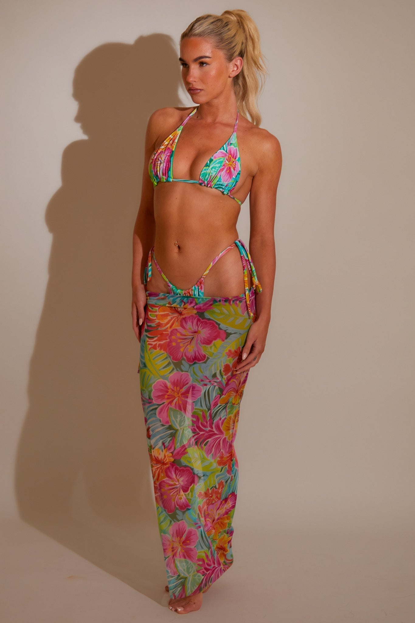 Styling a mesh swim skirt as a beach to bar cover-up